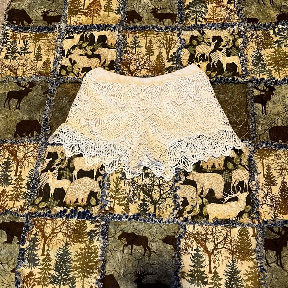 Teens white poly lining skort with a lace cover, elastic waste, very fashionable